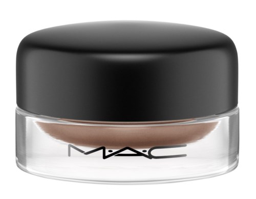 A small round container with a black lid and clear base, showing a makeup product inside.