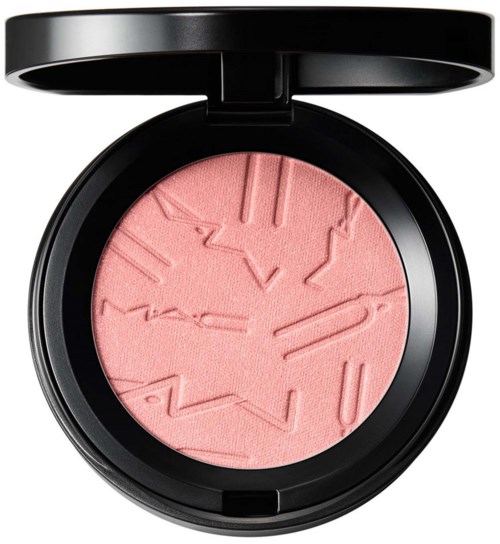 Pink blush in a black compact with embossed clock and jewelry designs.