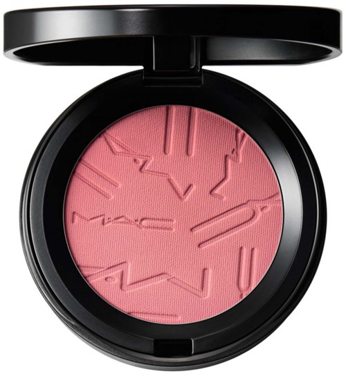 Pink blush with abstract, uneven patterns inside a black compact.