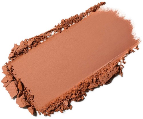 A rectangular makeup powder with a smooth surface and rough edges, in a light brown color.