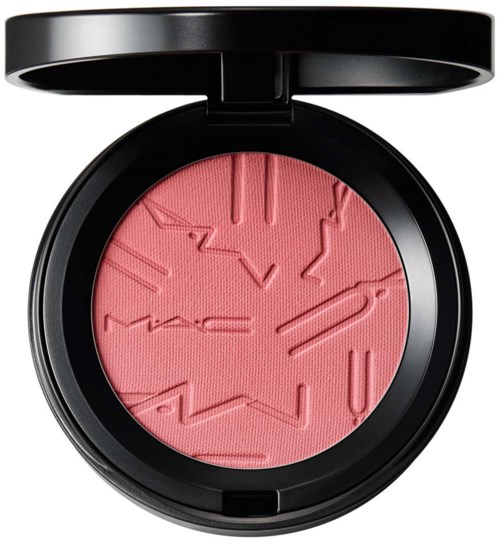 Pink blush with raised zigzag and line patterns inside a round black compact. The lid is open.