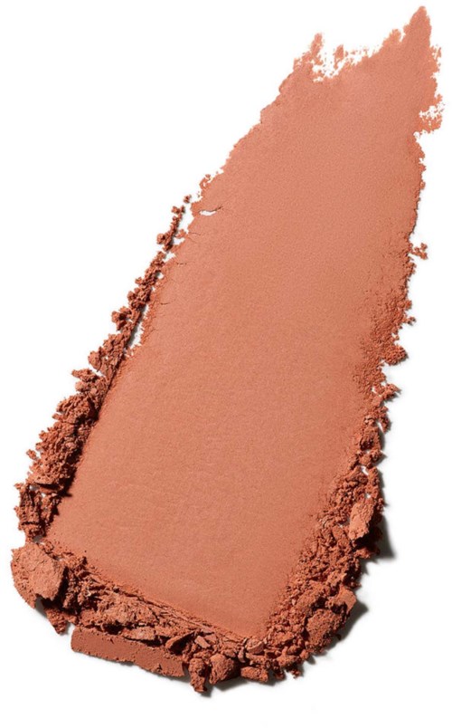 A patch of light brown powdered makeup with a smooth surface and rough edges.