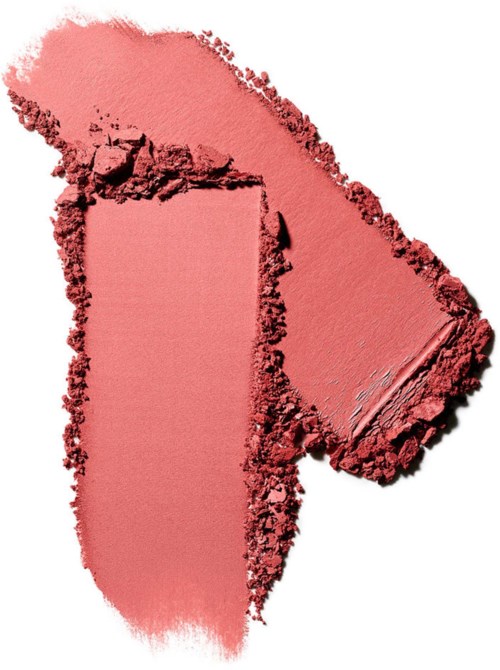 A red lipstick mark with smudges on white background.
