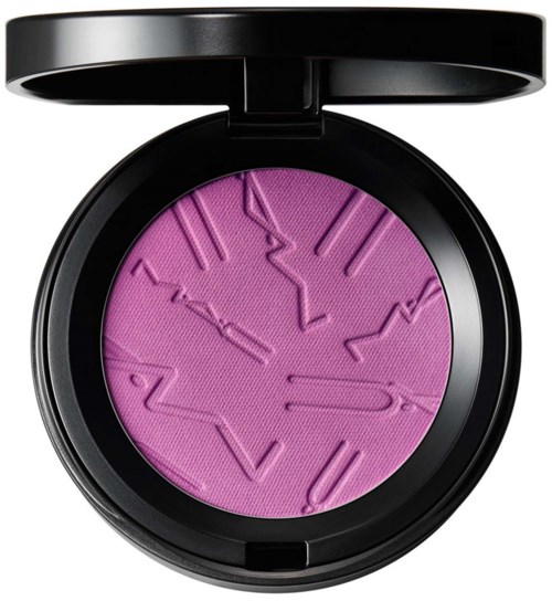A purple pressed powder with a textured pattern, inside a black round compact with a lid.