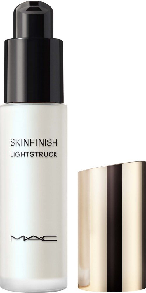 A white bottle with a black cap and gold-colored lid next to it. The bottle is labeled MAC SKINFINISH LIGHTSTRUCK.