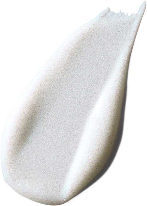 A white seashell with a smooth, curved surface and pointed tip, cast in shadow on a white background.