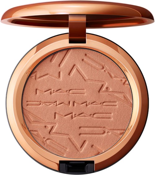 A round makeup container with a rose gold lid, open to show peach-colored pressed powder with embossed MAC logo.