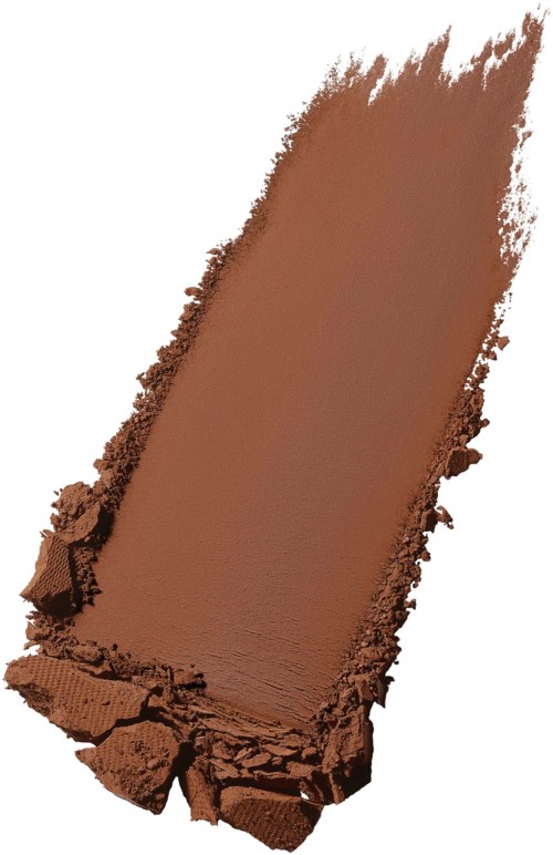A piece of brown powder or chalk broken at the edges, lying on a white background.