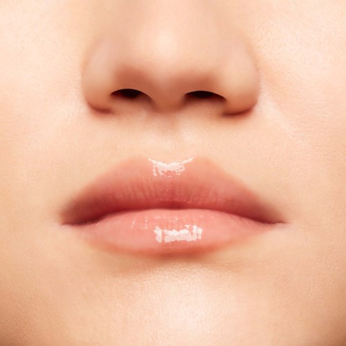 Close-up of lips and part of nose, smooth skin, natural look.
