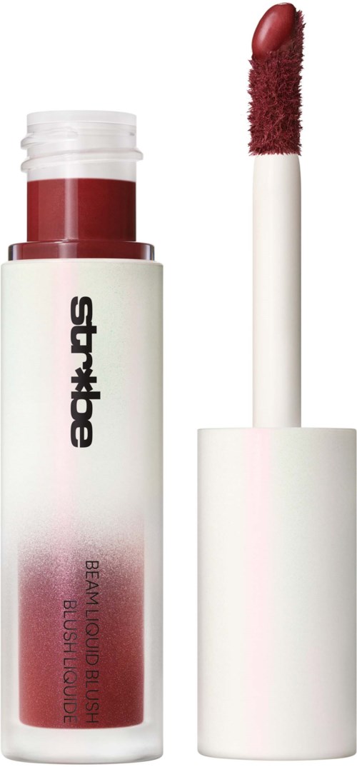 A lipstick in a white tube with black text, with the lid off showing the red lipstick inside.