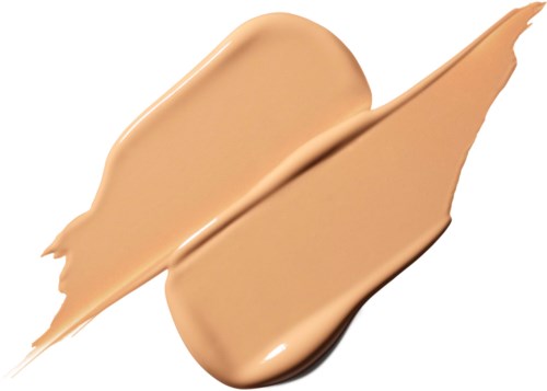 A beige liquid spread with a brush, with pancake-like shapes and streaks.