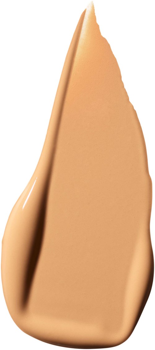 A beige, elongated smear of liquid or cream with a pointed tip on top.