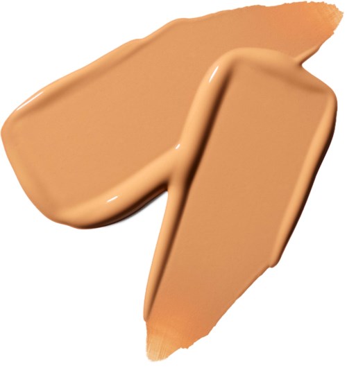 A beige liquid foundation swatched with a brush, showing creamy texture and smooth coverage.