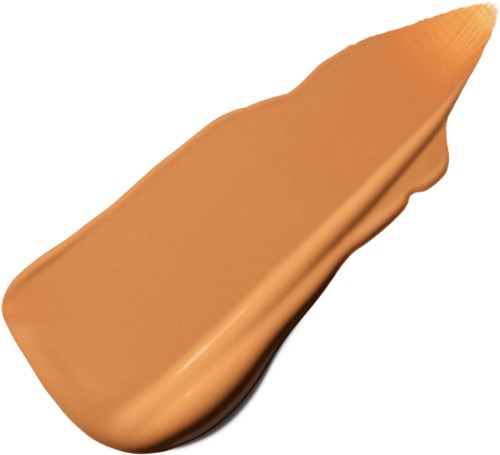 A makeup sponge with a pointed tip, beige in color and slightly curved shape.