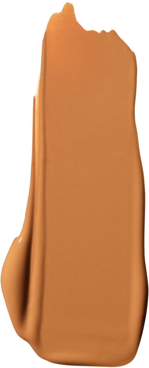 A blob of brownish liquid with a smooth, shiny surface and uneven edges.