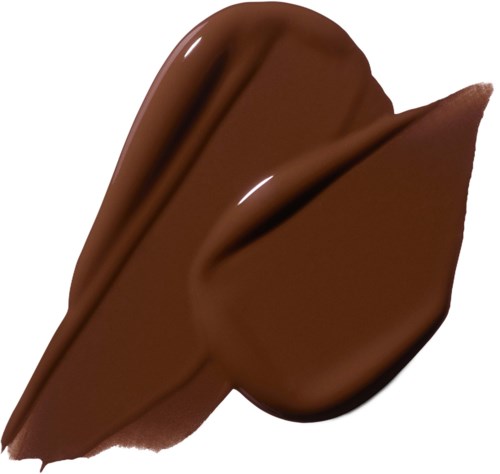 A thick line of melted chocolate with a smooth, shiny surface and a slight curve.