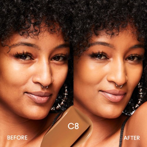 Close-up of a woman with curly hair, showing a side-by-side 'before' and 'after' of using a C8 skincare product.