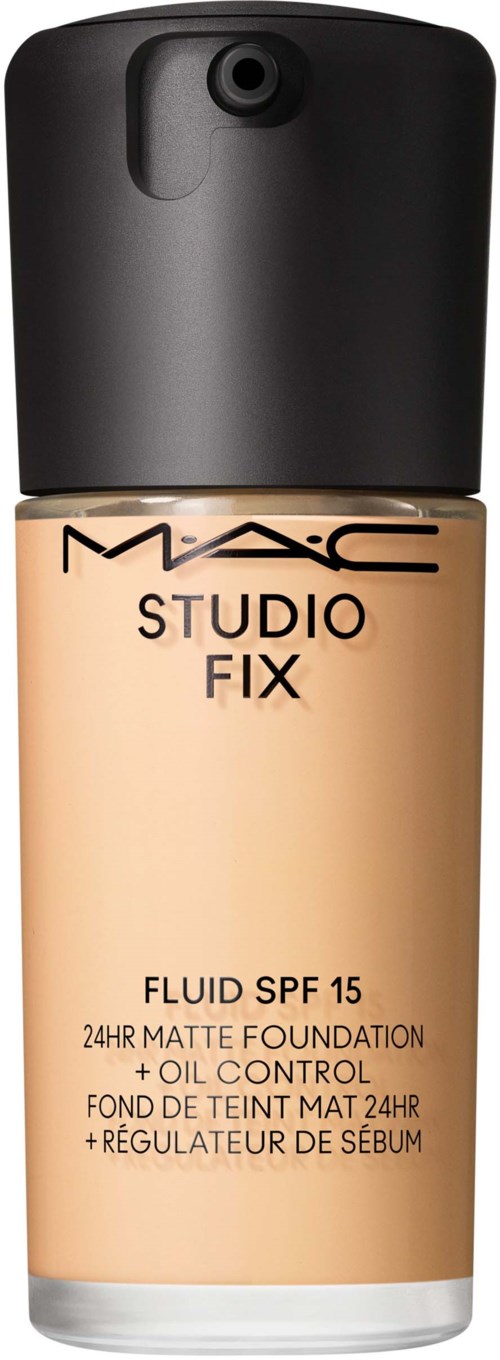 A beige foundation bottle with a black cap, labeled 'MAC Studio Fix' and 'SPF 15' for skin coverage.