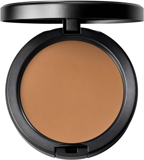 A round makeup compact with a black case, open to show skin-colored powder inside.