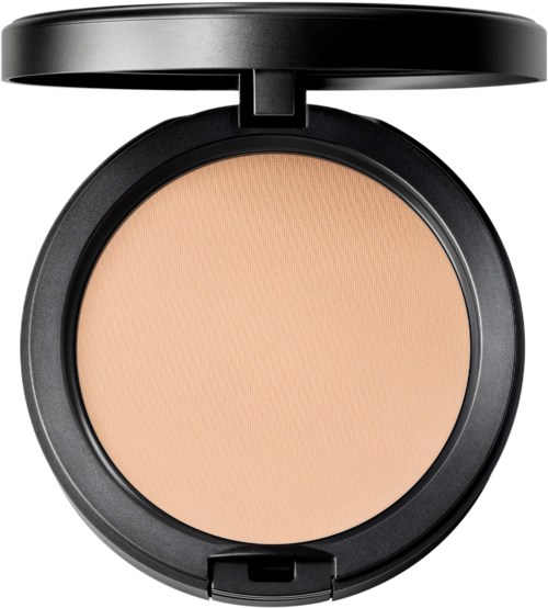 A compact with beige pressed powder, black round case, and a lid opened upward.