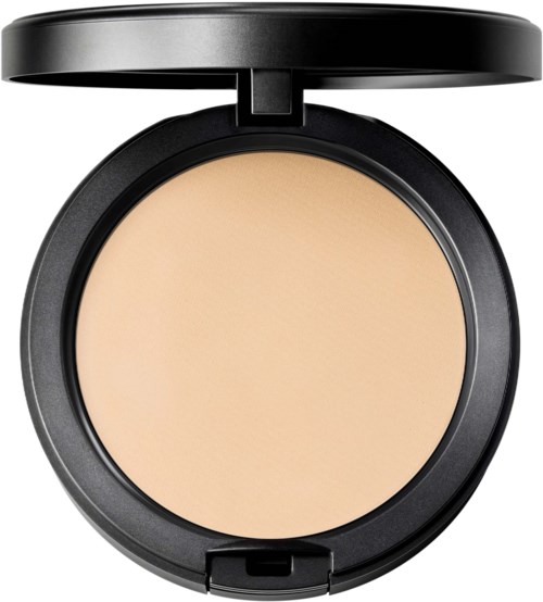 A round beige powder compact with the lid open, showing pressed powder inside.
