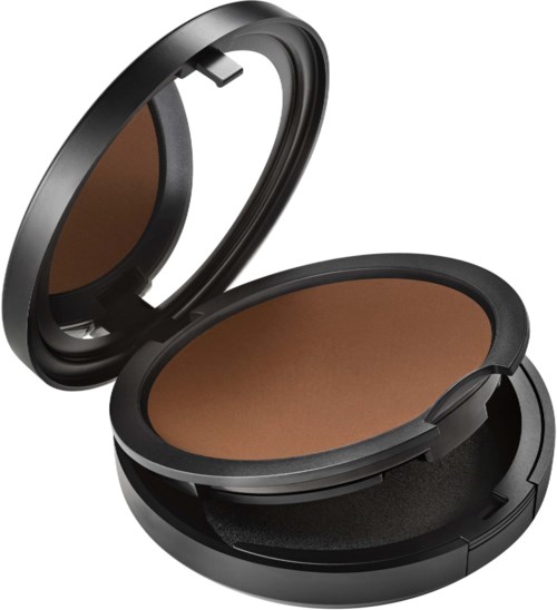A compact makeup powder case with a mirror inside, containing brown powder. The case is black and oval-shaped.