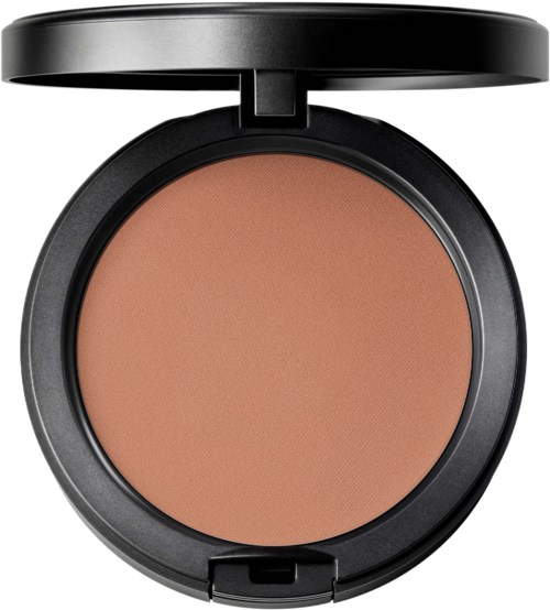 A round makeup compact with beige powder and a black lid that opens to reveal the powder inside.