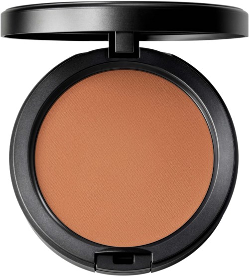 A round makeup compact with brown powder inside and a black lid open.