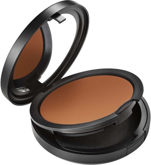 A compact makeup or sunscreen case with a mirror and a tan-colored powder inside.