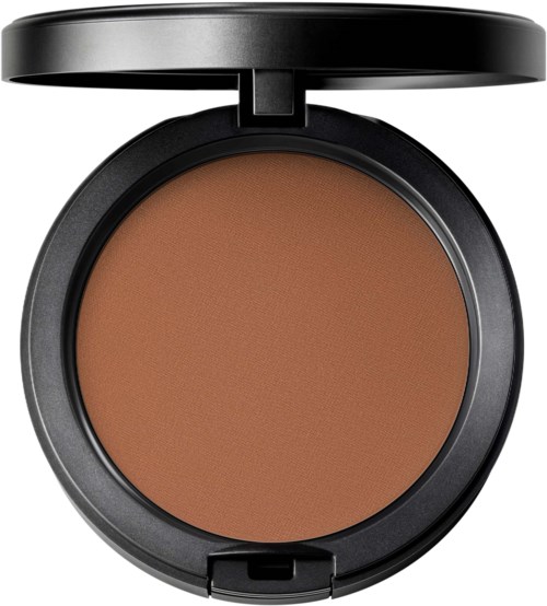 A round compact with brown pressed powder and a black lid. No makeup brush visible.