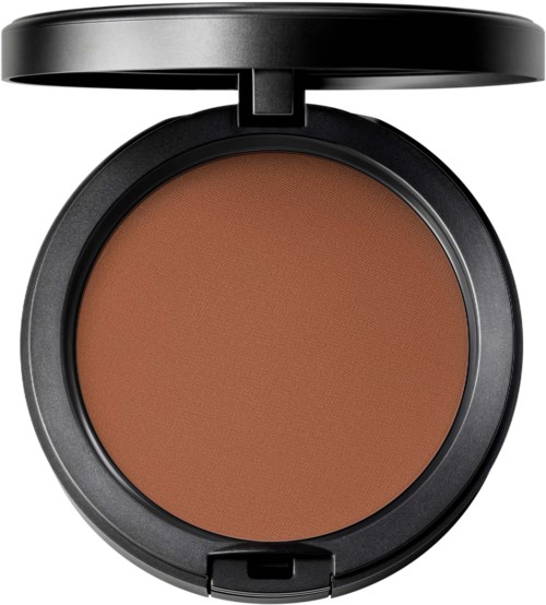A round compact makeup case with a brown powder inside and a lid that is open.