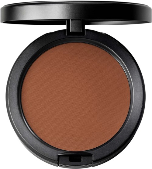 A round makeup compact with brown powder and a black lid, slightly open.