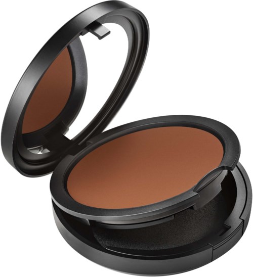 A compact makeup mirror with a built-in mirror and a brown powder inside the case.