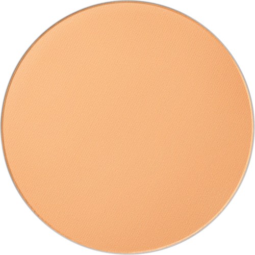 Et rundt blush-makeupprodukt med lys ferskenfarge og matt overflate.