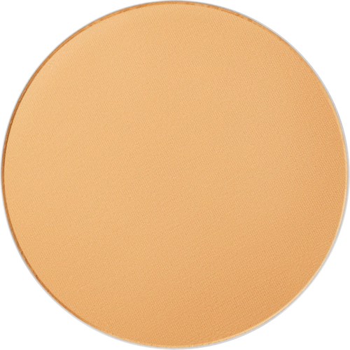 A round, peach-colored foundation makeup with a smooth, matte finish.