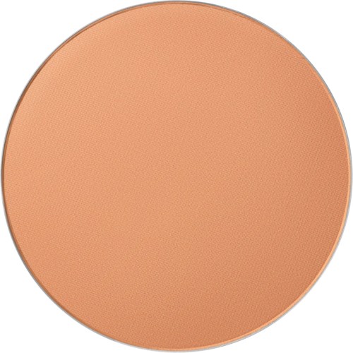 A round, peach-colored makeup powder or blush with a textured surface.