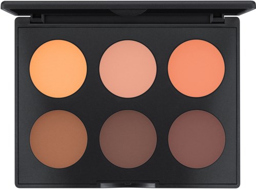 A makeup palette with six circular shades in warm colors, arranged in two rows inside a black case.