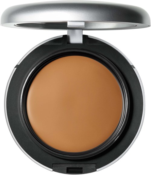 En liten sminkväska med lock, innehållande beige pressad puder för ansikte eller kropp.