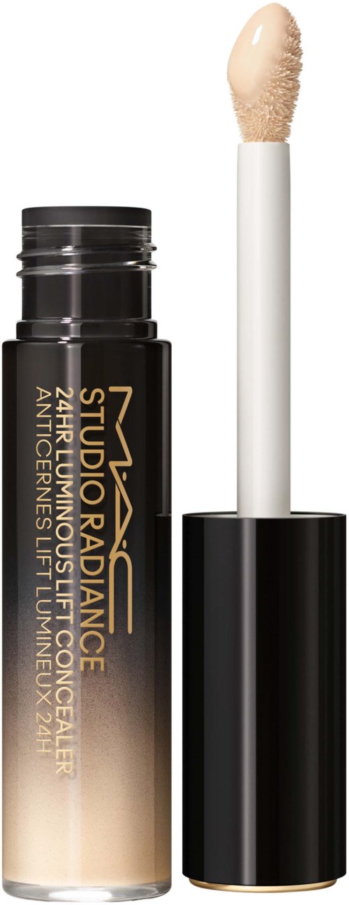 Ein Stick-Foundation-Behälter mit abnehmbarer Applikatorbürste, schwarze und goldene Verpackung, beschriftet "Studio Radiance".