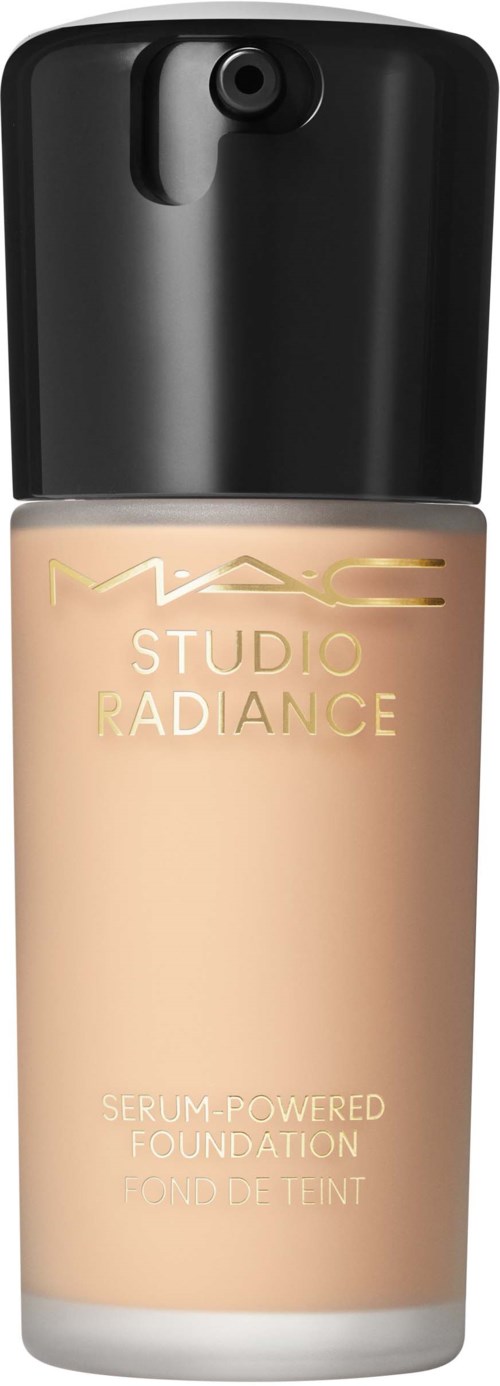 A bottle of MAC Studio Radiance foundation with a black cap and beige liquid inside.