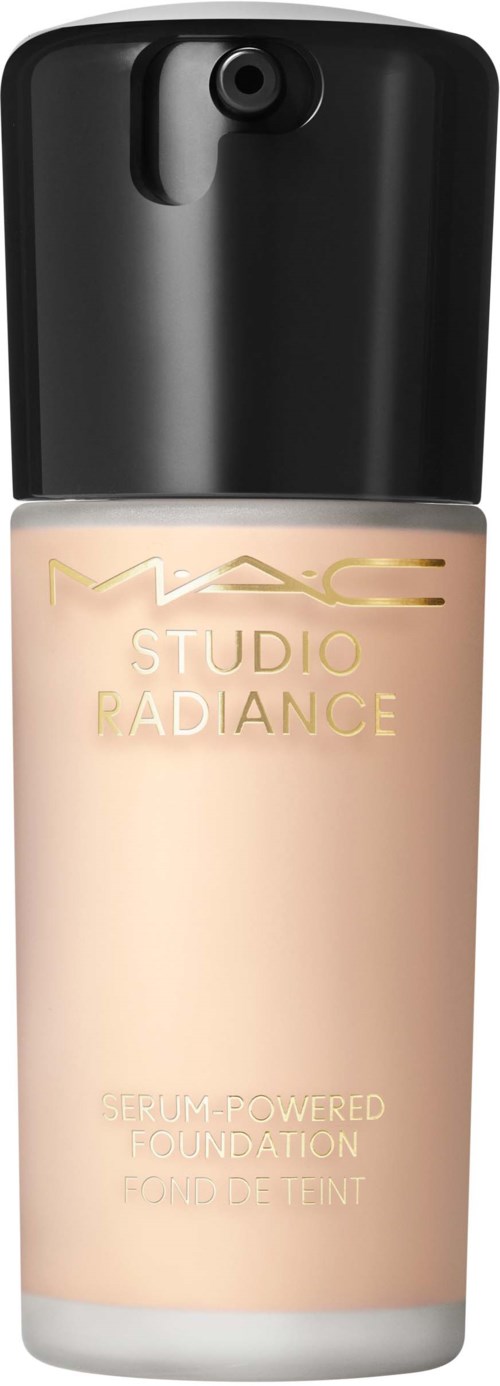 A bottle of MAC Studio Radiance serum-powered foundation with a black cap and light beige liquid inside.