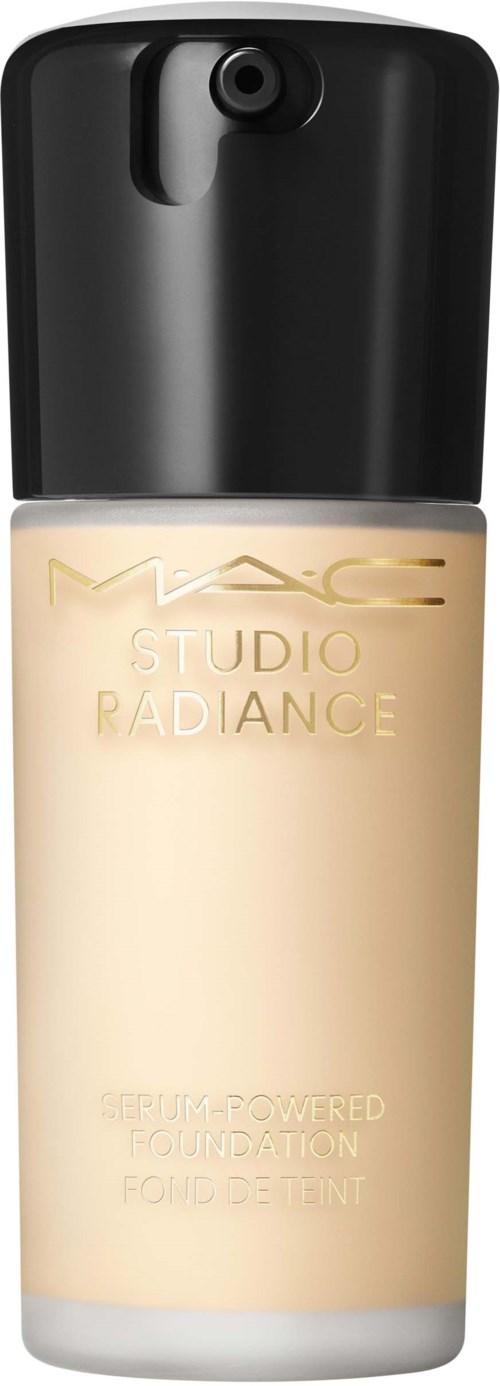 A bottle of MAC Studio Radiance foundation with a black cap and light beige liquid inside.
