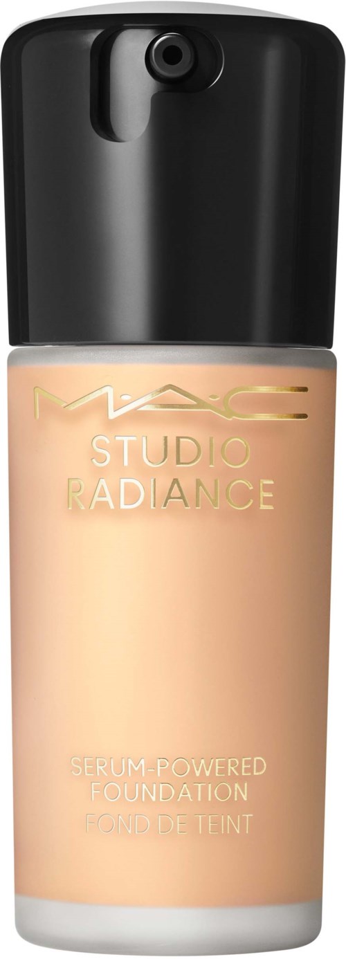 A bottle of MAC Studio Radiance foundation with a black cap and beige liquid inside.