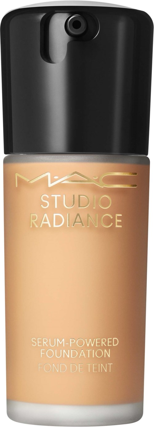 A bottle of MAC Studio Radiance foundation with a black cap and beige liquid inside.