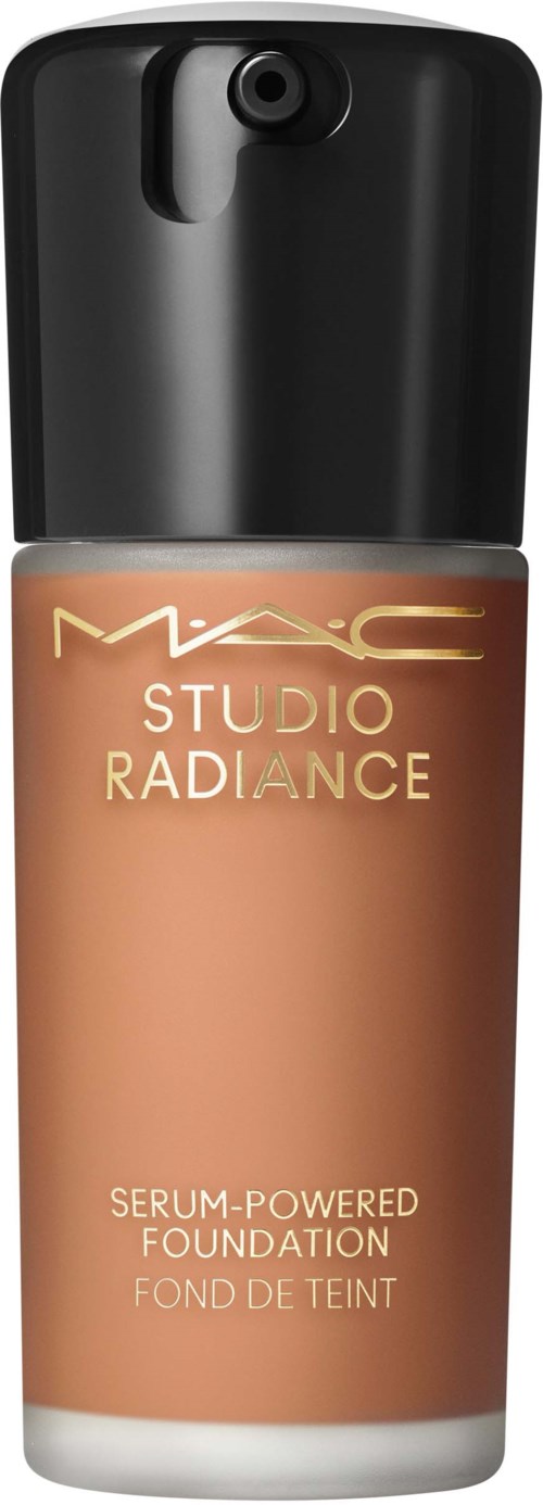 A bottle of MAC Studio Radiance serum-powered foundation with a black cap and beige liquid inside.