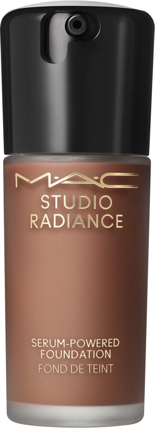 A bottle of MAC Studio Radiance foundation with a black cap and beige liquid inside.