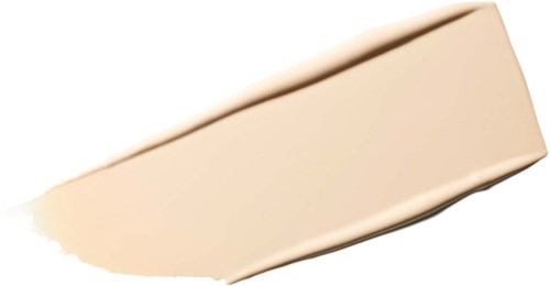 Fargeprøve av lys beige foundation eller concealer på en kremaktig bakgrunn.