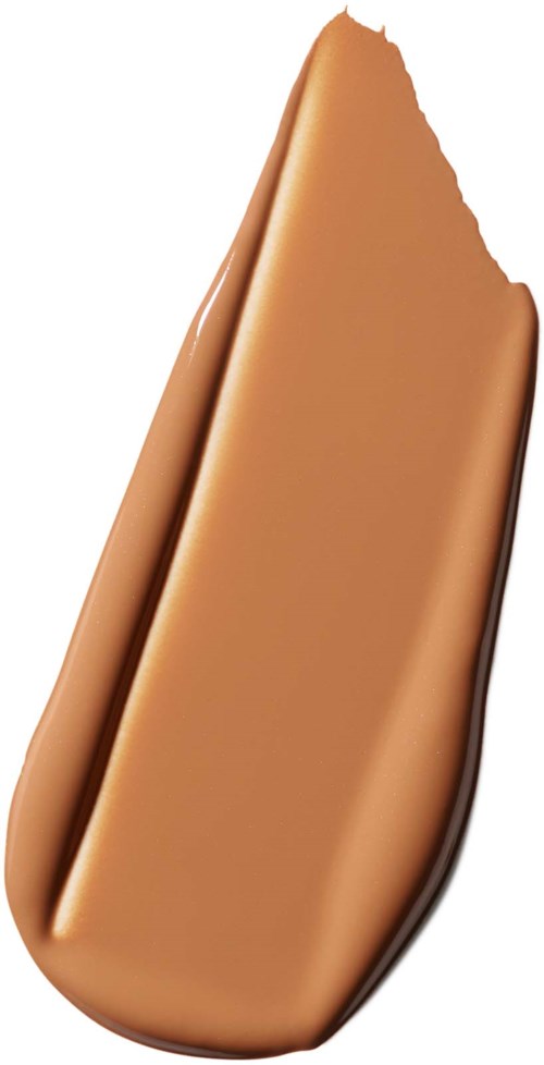 En beige flytende foundation-svamp med ren, jevn kant på hvit bakgrunn.