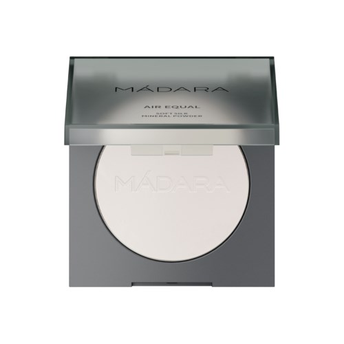 A white powder compact with a silver lid labeled 'MADARA Air-Fouled'. It appears to be a makeup product.