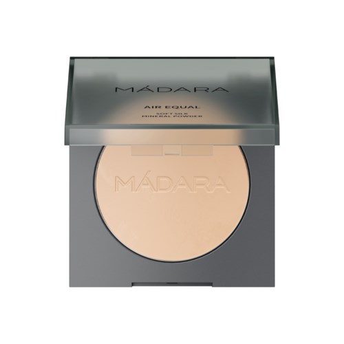 A compact with pressed powder inside a gray case, labeled 'MADARA AIR CUSHION'.